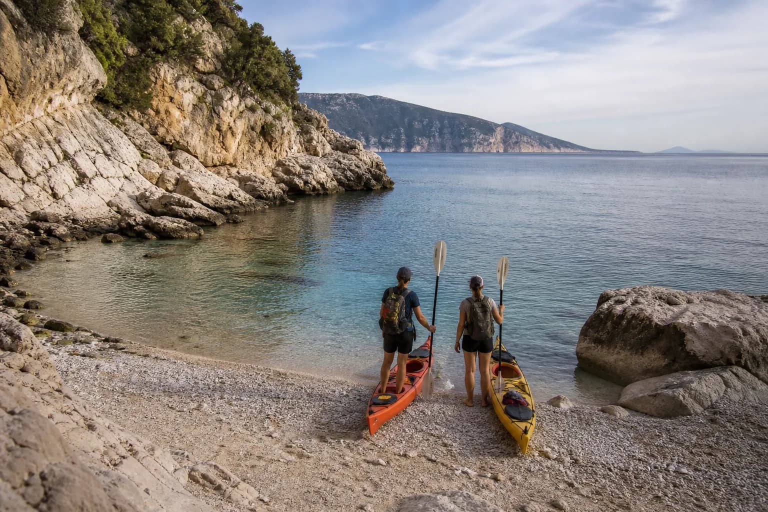 Kayaks along the Gulf of Orosei cliffs from Cala Gonone