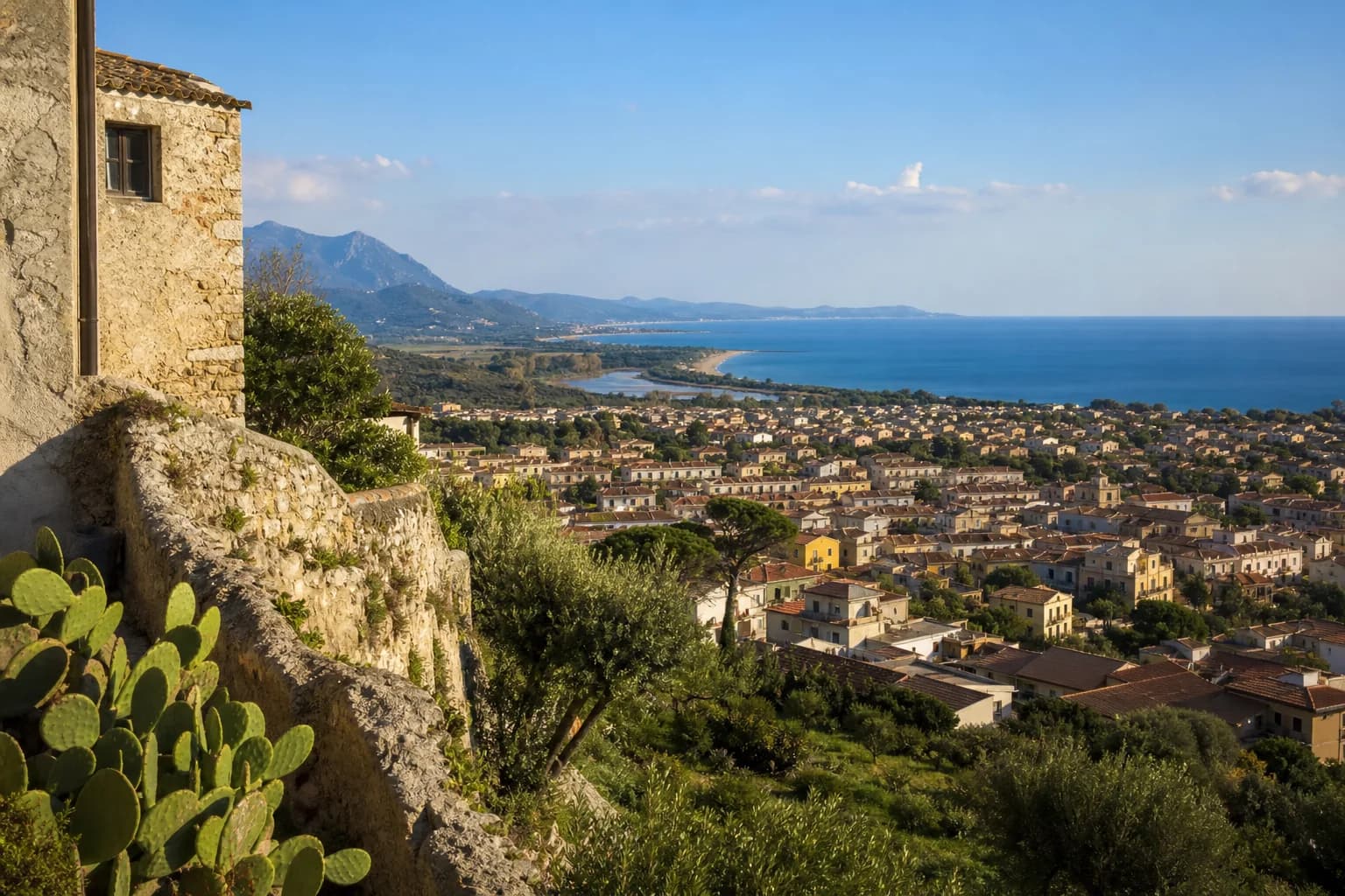 Orosei old town with stone houses and outdoor tables
